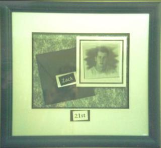 The card and photo are floated and a plaque created which is attached to the top matboard